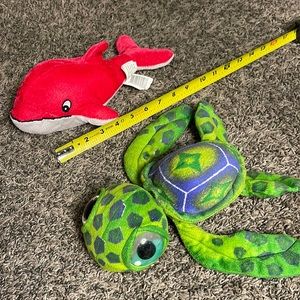 Stuffed animals sea creatures green turtle and pink whale